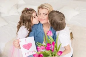 Kids give mom a personal card on Mother's day reflecting a positive co-parenting relationship.