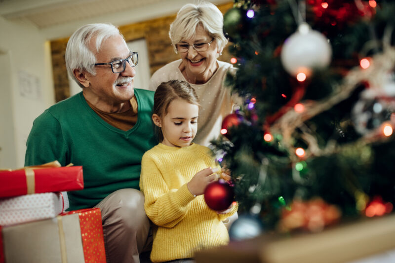 arizona grandparent rights - granddaughter decorating Christmas tree with grandparents